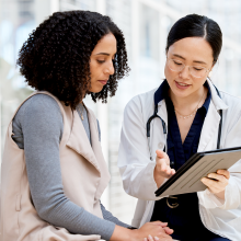 An image of a doctor talking to a patient